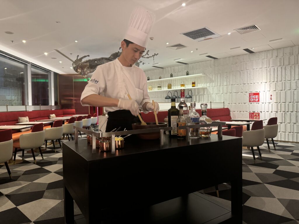 A chef prepares steak tartare tableside at the 5 star Hotel Eclat in Beijing